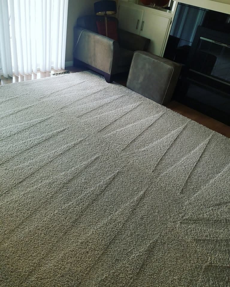 A living room carpet with vacuum lines after cleaning